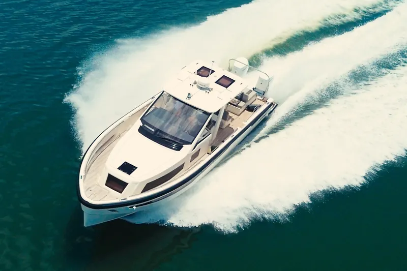 Slide: The Image of A 2022 Windy SR44 speeds across the water, leaving a white wake behind. - 0