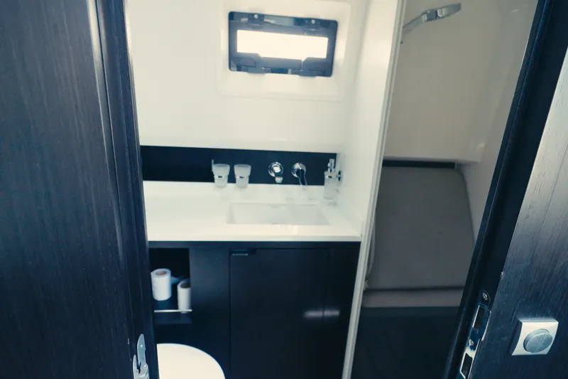 Slide: The Image of Modern bathroom interior on 2022 Windy SR44 yacht, featuring sleek design and fixtures. - 20