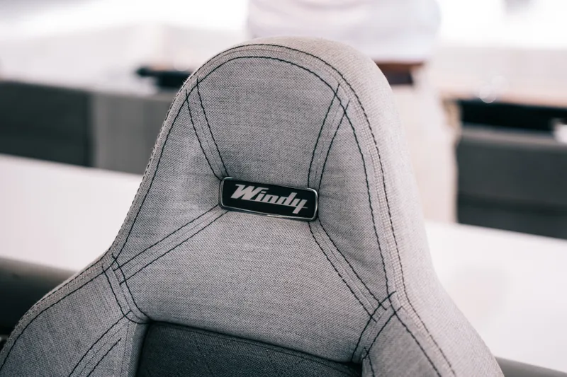 Slide: The Image of Gray upholstered seat with "Windy" logo, from 2022 Windy SR44 model. - 13