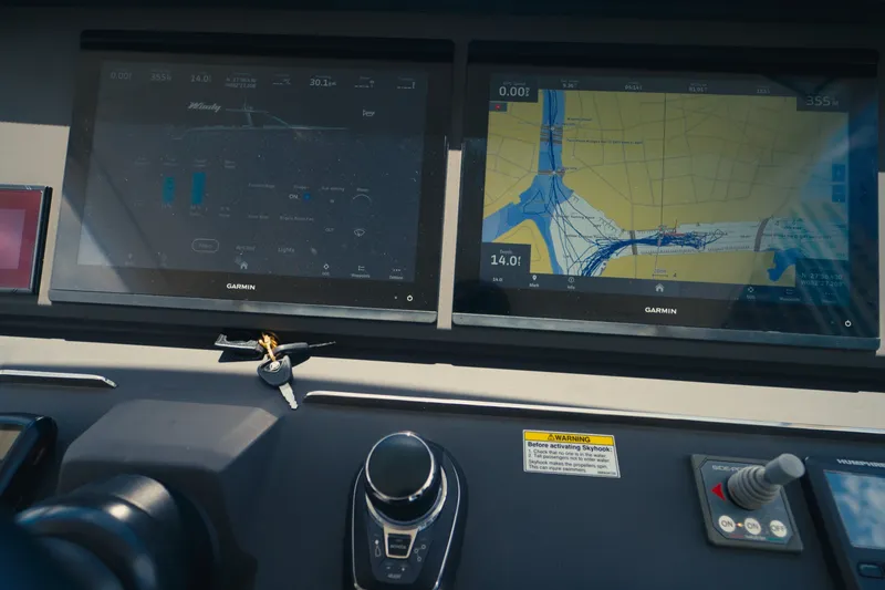 Slide: The Image of Control panel of 2022 Windy SR44 boat with Garmin navigation screens. - 16