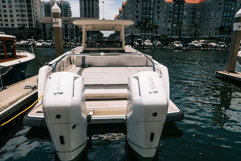 Slide: The Image of The 2022 Windy SR44 is docked, featuring two powerful outboard engines and a sleek design. - 4