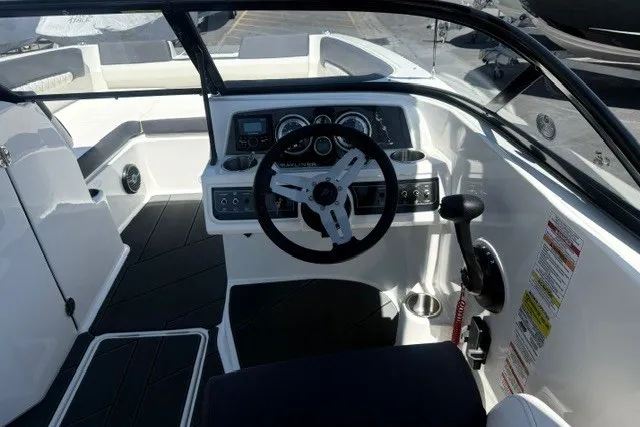 Slide: The Image of 2026 Bayliner D22 boat cockpit with steering wheel and control panel. - 16