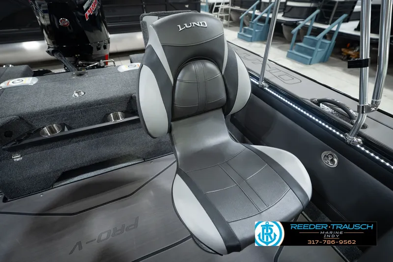 Slide: The Image of Lund 1975 Pro-V Sport 2026 boat seat, gray and black design, Reeder-Trausch Marine logo. - 51