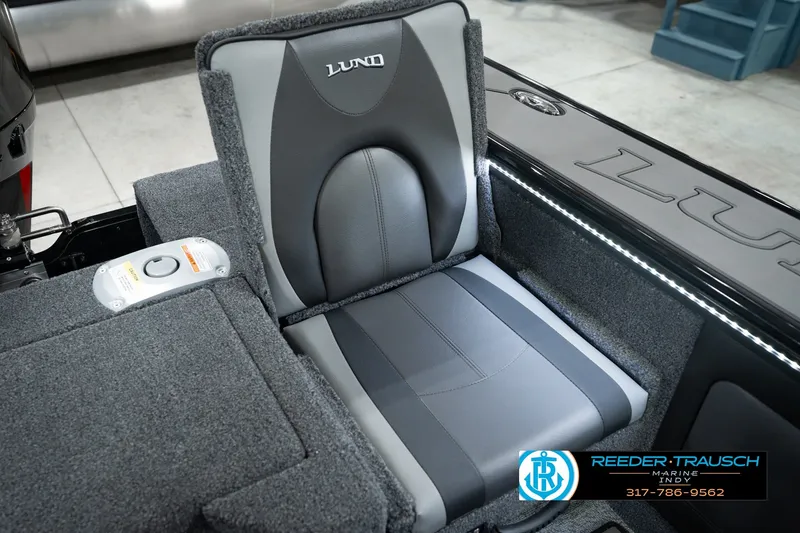 Slide: The Image of Gray seating in a 2026 Lund 1975 Pro-V Sport boat, featuring sleek design and branding. - 52