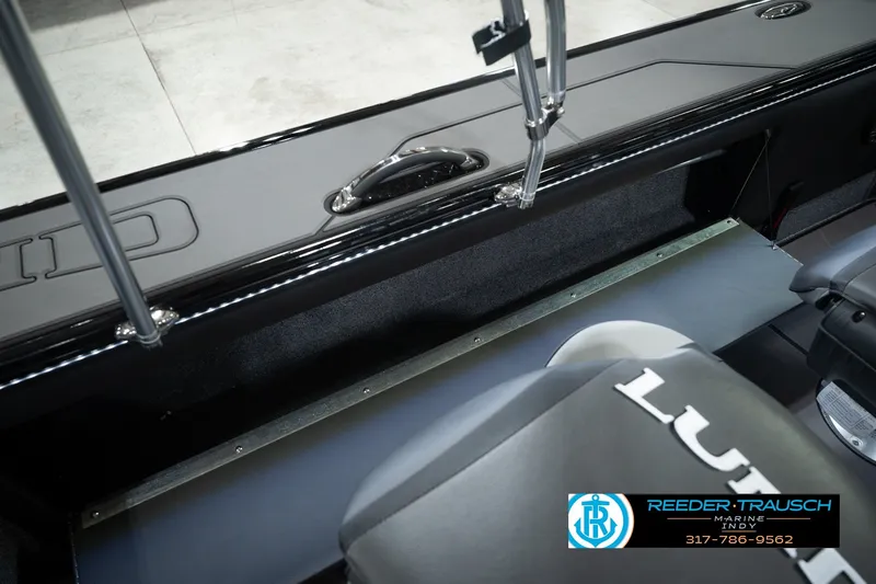 Slide: The Image of Interior of 2026 Lund 1975 Pro-V Sport boat with seating and branding details. - 30