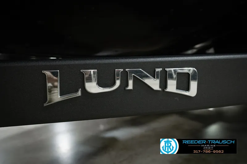 Slide: The Image of Close-up of Lund logo on 2026 Pro-V Sport boat, Reeder-Trausch Marine branding visible. - 67