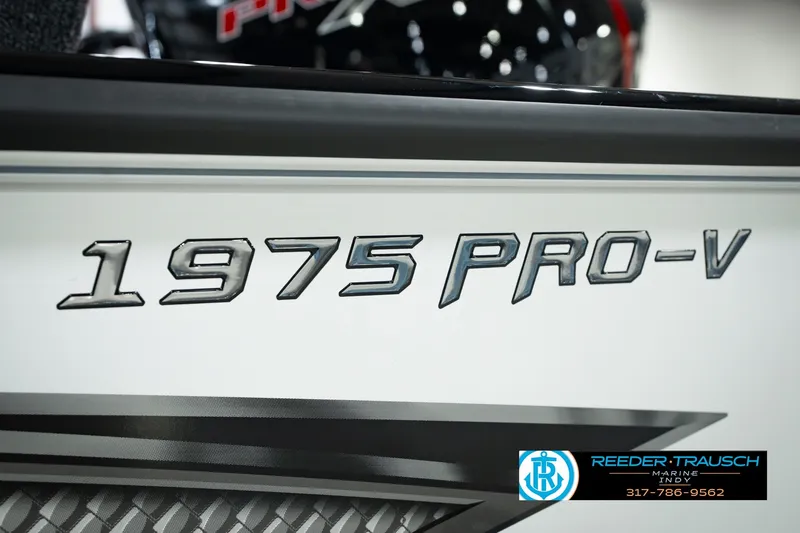 Slide: The Image of Lund 1975 Pro-V Sport 2026 model boat branding with Reeder-Trausch Marine logo. - 63