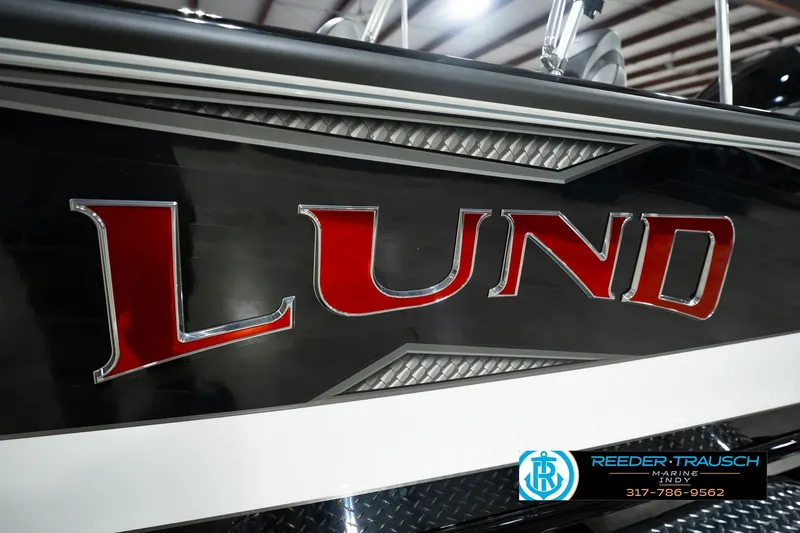 Slide: The Image of Close-up of 2026 Lund 1975 Pro-V Sport boat logo in bold red lettering. - 62