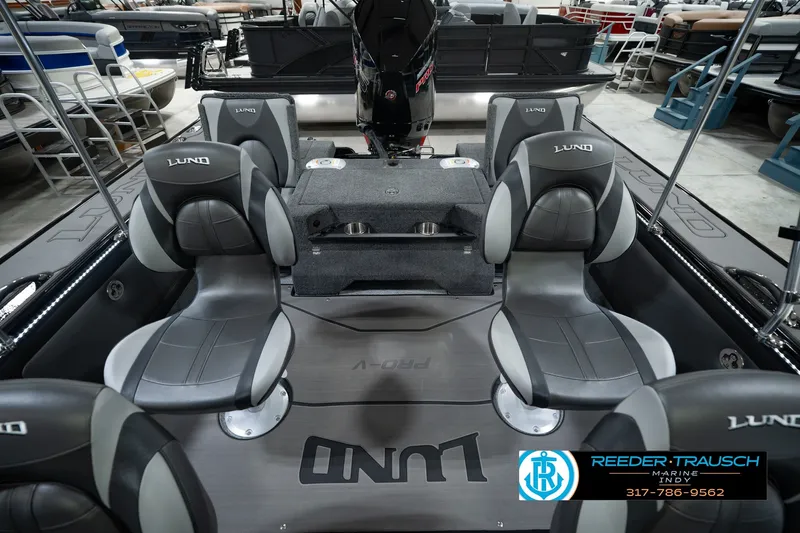 Slide: The Image of 2026 Lund 1975 Pro-V Sport boat interior with gray seating and modern design. - 24