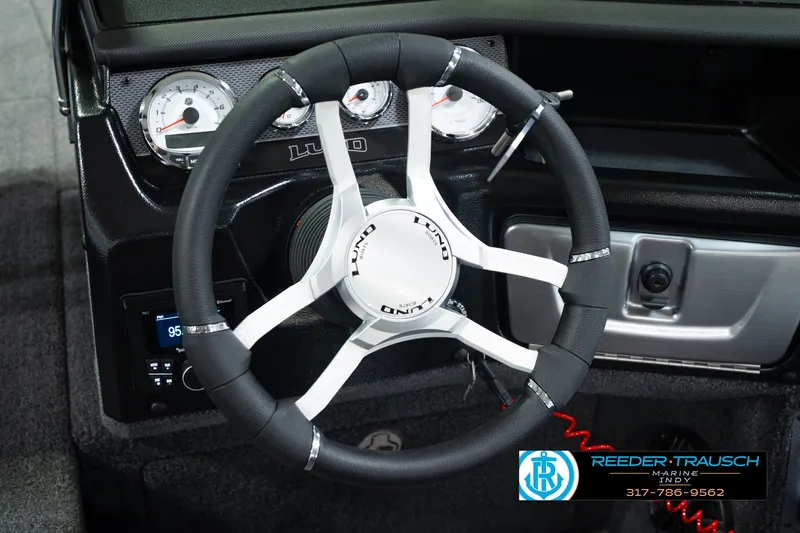 Slide: The Image of Steering wheel of 2026 Lund 1975 Pro-V Sport boat with dashboard instruments. - 37