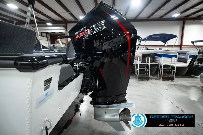 Slide: The Image of 2026 Lund 1975 Pro-V Sport boat with Mercury Pro XS engine in showroom. - 57