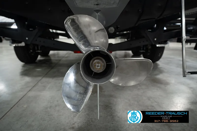 Slide: The Image of Propeller of 2026 Lund 1975 Pro-V Sport boat in showroom, Reeder Trausch Marine logo visible. - 61