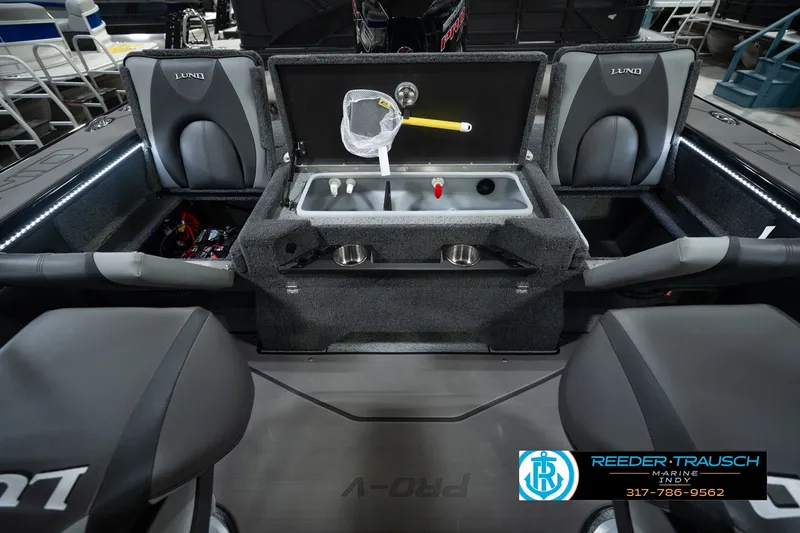 Slide: The Image of 2026 Lund 1975 Pro-V Sport boat interior with seating and storage compartments. - 28
