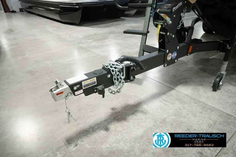 Slide: The Image of Trailer hitch of 2026 Lund 1975 Pro-V Sport boat in showroom setting. - 64