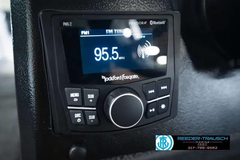 Slide: The Image of Rockford Fosgate audio system in 2026 Lund 1975 Pro-V Sport boat, displaying FM 95.5 MHz. - 39