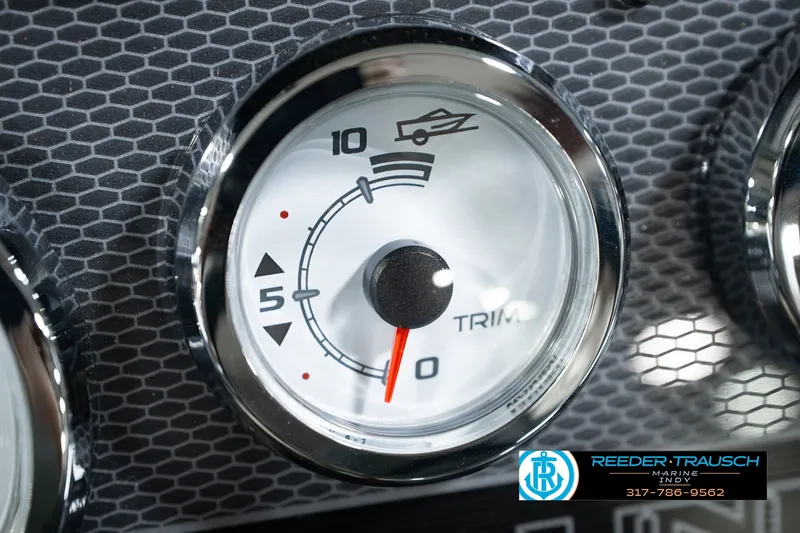 Slide: The Image of Gauge panel of 2026 Lund 1975 Pro-V Sport boat, featuring trim indicator. - 41