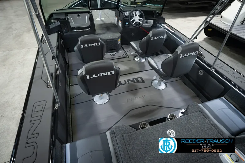 Slide: The Image of 2026 Lund 1975 Pro-V Sport boat interior with four seats and modern dashboard. - 17