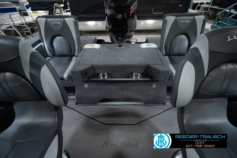 Slide: The Image of Interior of 2026 Lund 1975 Pro-V Sport boat with seating and storage compartments. - 25