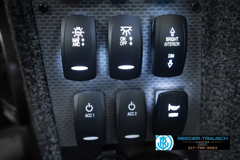 Slide: The Image of Control panel of 2026 Lund 1975 Pro-V Sport boat with illuminated switches. - 46