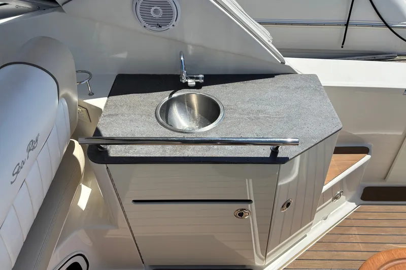 Slide: The Image of 2013 Sea Ray Sundancer 310 boat interior with sink and countertop. - 8