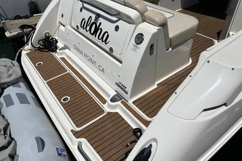 Slide: The Image of 2013 Sea Ray Sundancer 310 boat deck with "Aloha" name, docked at Dana Point, CA. - 4