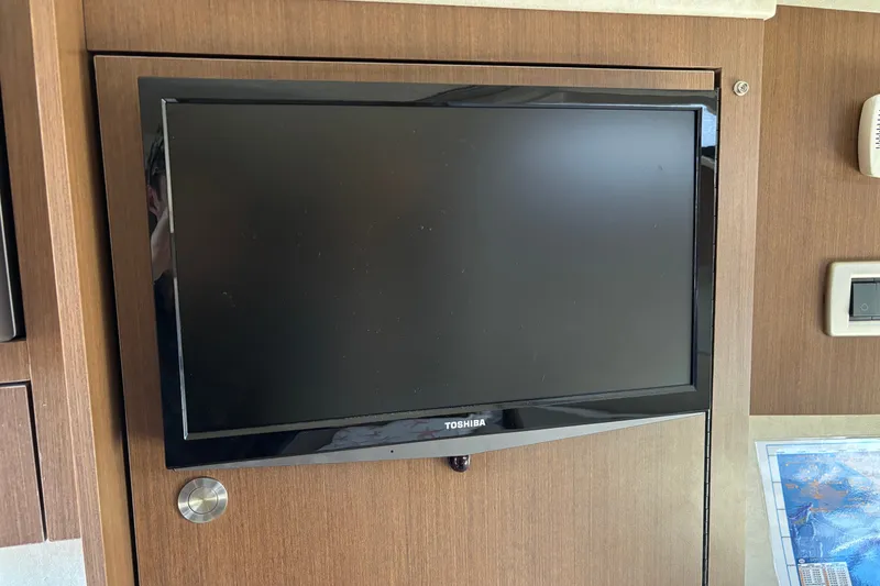 Slide: The Image of Toshiba TV mounted on a 2013 Sea Ray Sundancer 310 yacht interior. - 25