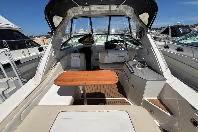 Slide: The Image of Interior view of a 2013 Sea Ray Sundancer 310 yacht with seating and helm. - 6