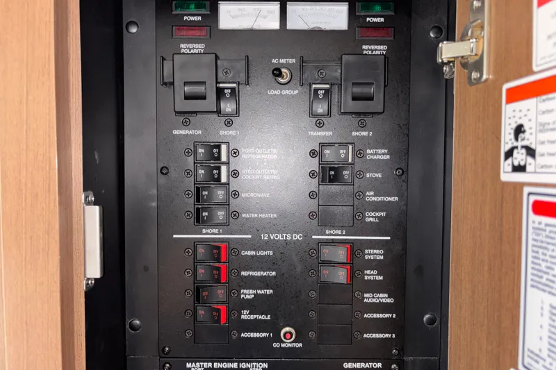 Slide: The Image of Electrical control panel on a 2013 Sea Ray Sundancer 310 boat. - 21