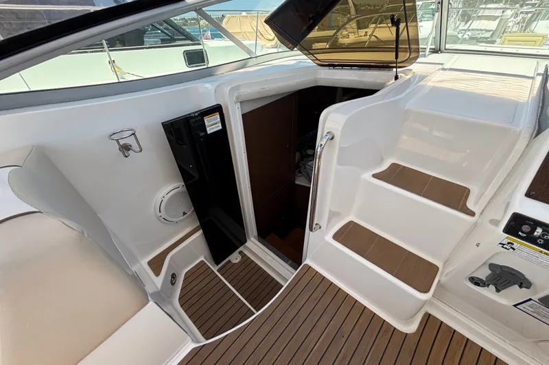 Slide: The Image of 2013 Sea Ray Sundancer 310 boat interior with steps and cabin entrance. - 13