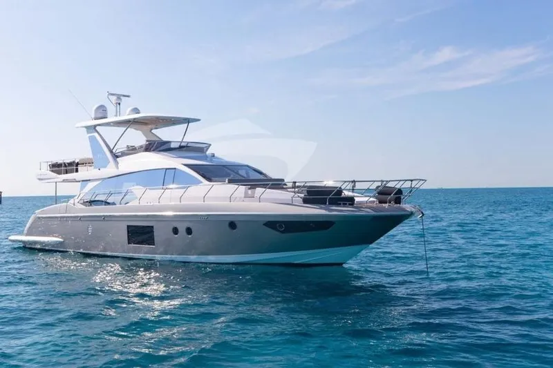 The Image of 2018 Azimut 66 Flybridge yacht on clear blue ocean under sunny sky. - 0