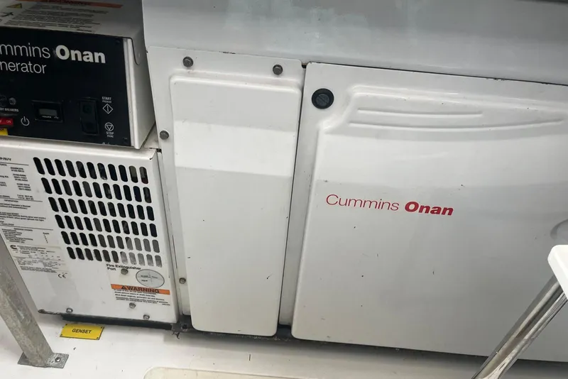 Slide: The Image of Cummins Onan generator on 2018 Azimut 66 yacht, showcasing control panel and ventilation. - 56