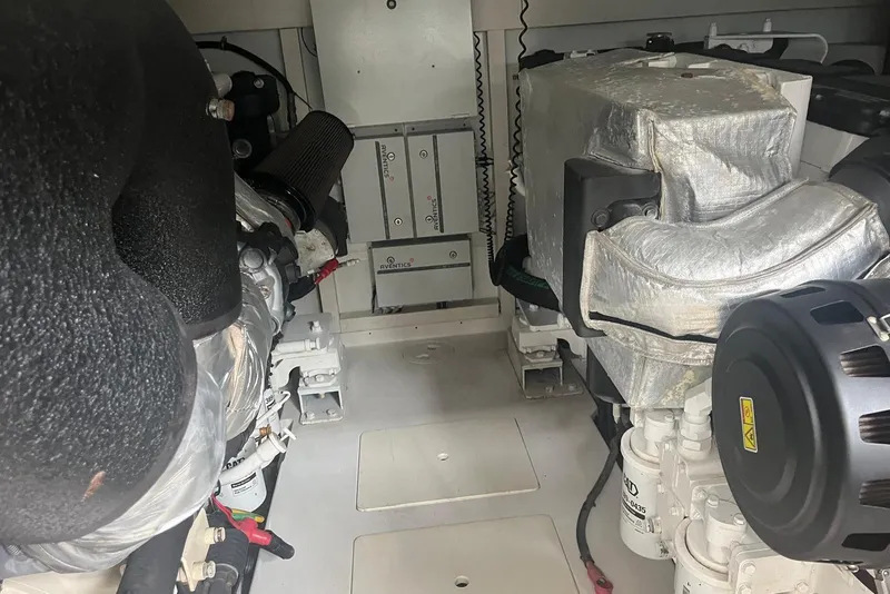 Slide: The Image of Engine room of a 2018 Azimut 66 yacht, showcasing mechanical components and equipment. - 60