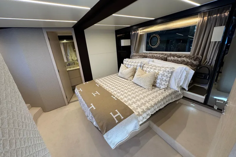 Slide: The Image of Luxurious bedroom interior of 2018 Azimut 66 Flybridge yacht with elegant bedding and modern design. - 34