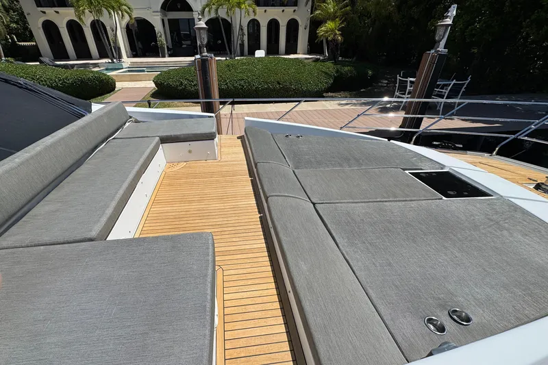 Slide: The Image of 2018 Azimut 66 Flybridge yacht with spacious deck and luxurious seating. - 11