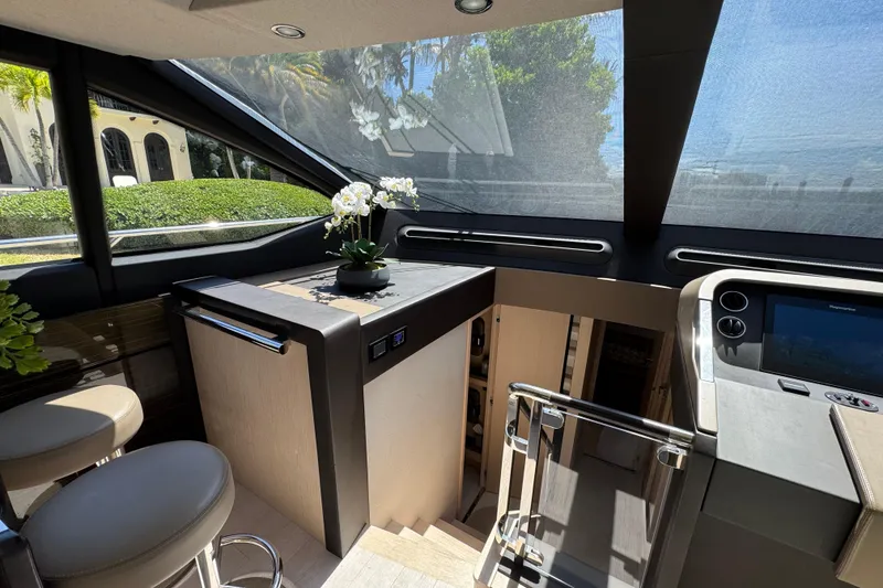 Slide: The Image of Luxurious interior of 2018 Azimut 66 Flybridge yacht with modern helm and elegant decor. - 31