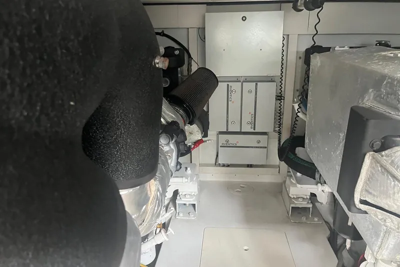 Slide: The Image of Engine room of a 2018 Azimut 66 yacht, featuring mechanical components and equipment. - 59