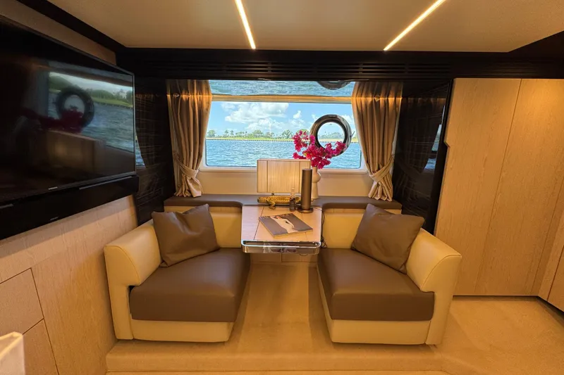 Slide: The Image of Luxurious interior of 2018 Azimut 66 Flybridge yacht with elegant seating and scenic window view. - 37
