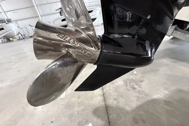 Slide: The Image of Propeller of a 2015 Boston Whaler 210 Montauk boat in a garage setting. - 21