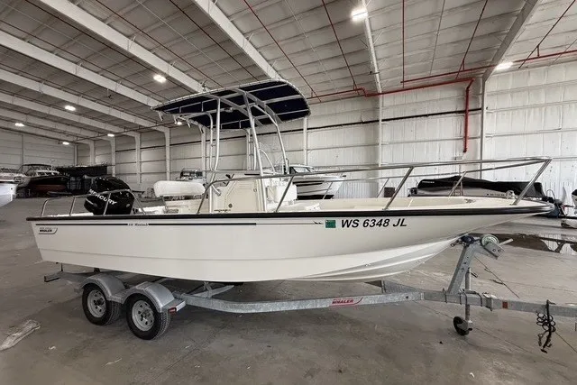Slide: The Image of 2015 Boston Whaler 210 Montauk boat on trailer in indoor storage facility. - 1