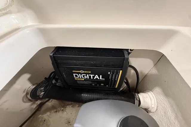 Slide: The Image of Battery compartment of a 2015 Boston Whaler 210 Montauk with Minn Kota digital charger. - 20