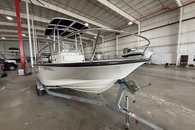 Slide: The Image of 2015 Boston Whaler 210 Montauk boat on trailer in spacious indoor storage facility. - 3