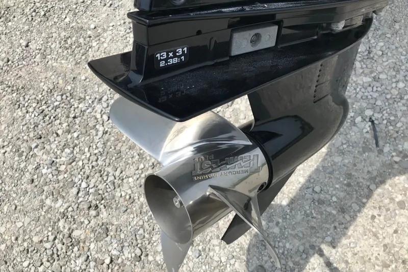 Slide: The Image of 2024 Ranger Z185 boat propeller on gravel surface, featuring Mercury Marine branding. - 13