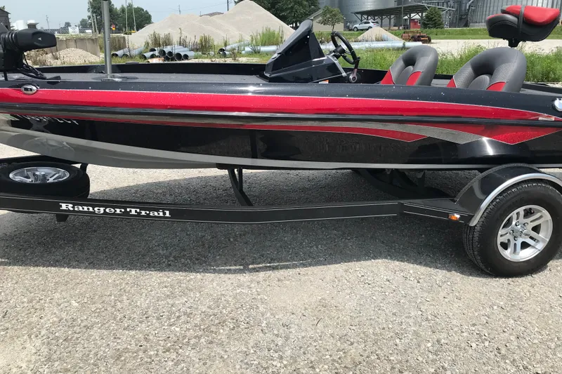 Slide: The Image of 2024 Ranger Z185 boat on trailer, featuring sleek red and black design. - 3