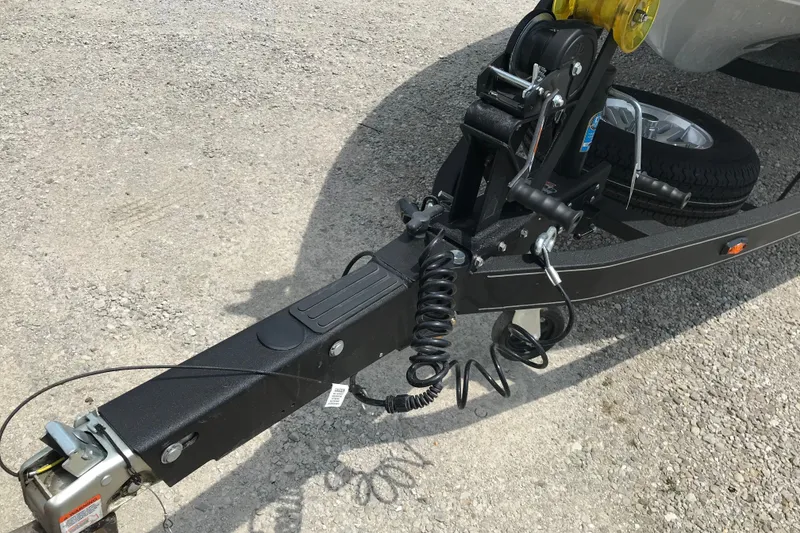 Slide: The Image of Trailer hitch and winch system of 2024 Ranger Z185 on gravel surface. - 16