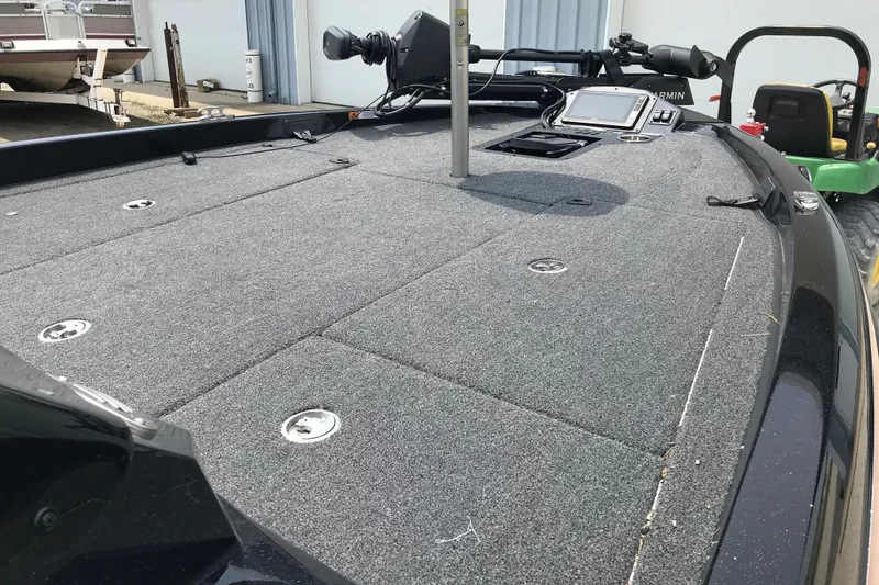 Slide: The Image of 2024 Ranger Z185 boat deck with carpeted surface and mounted equipment. - 9