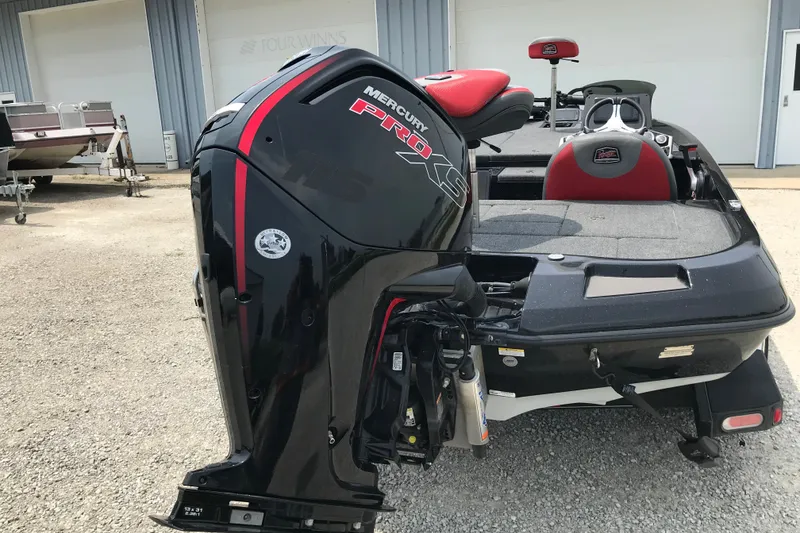 Slide: The Image of 2024 Ranger Z185 boat with Mercury Pro XS engine, parked outdoors. - 11