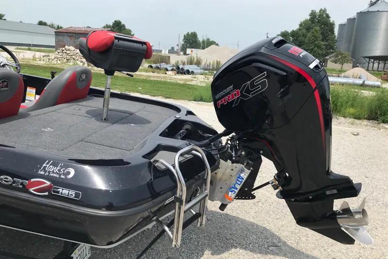 Slide: The Image of 2024 Ranger Z185 boat with Mercury Pro XS engine, parked outdoors on gravel. - 12