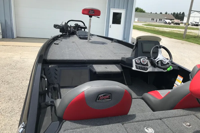 Slide: The Image of 2024 Ranger Z185 boat interior with steering console and seating. - 6