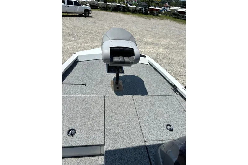 Slide: The Image of 2022 G3 Sportsman 1710 PFX boat deck with seating, parked in a lot. - 14