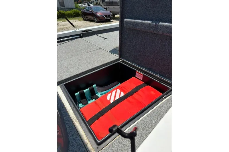 Slide: The Image of Open storage compartment in 2022 G3 Sportsman 1710 PFX boat with life jackets. - 16